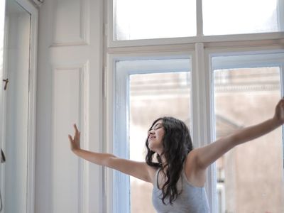 Morning stretching routine near the window.